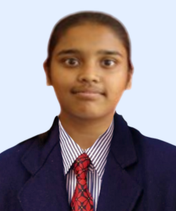 Student portrait in a navy blazer, striped shirt, and red tie, facing the camera against a light blue background.